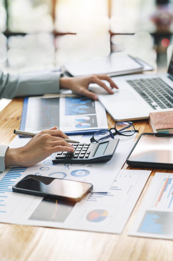 Businesswoman working at office with document on her desk, doing